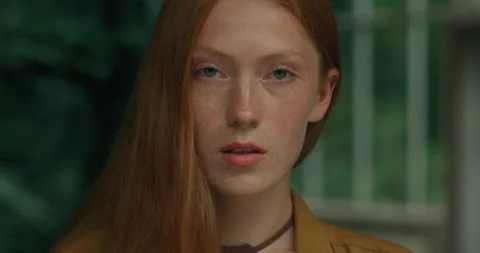 Front View of Cute Red-Haired Girl having Blue Eyes looking into camera Stock Footage 159228527