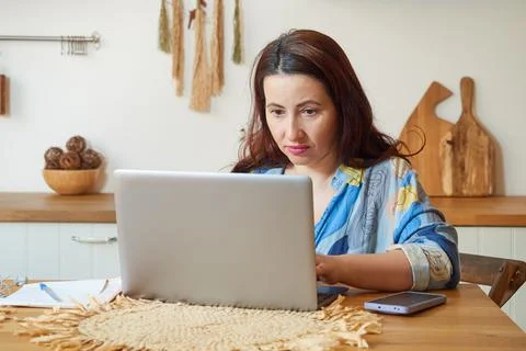 Front view cute woman using laptop, remote work at home, online learning, cor Stock Photos