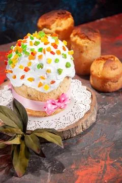 Front view delicious easter cake with white cream and dried fruits on dark .. Stock Photos