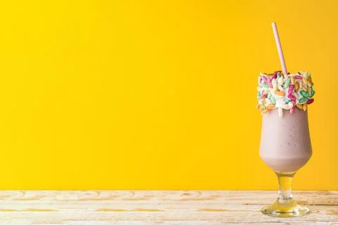 Front view delicious milkshake yellow background Stock Photos