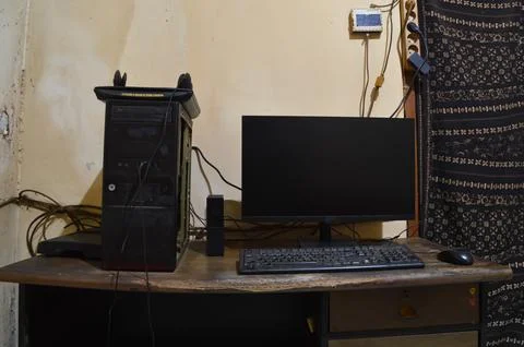 Front View of Desktop Computer Workspace with Peripheral Devices Stock Photos