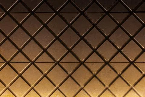 Front view of diagonal lattice grid pattern of concrete wall Stock Photos