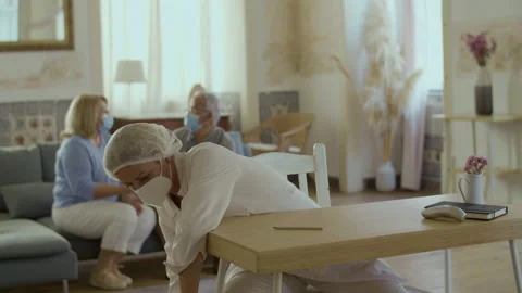 Front view of doctor preparing for vaccination procedure at home 動画素材 225979125