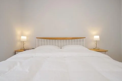 Front view on the double bed in the bedroom interior Foto stock