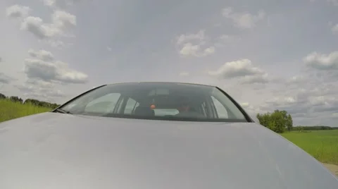 Front View of Driver Driving A Car on Country Road on Holidays Vídeos de archivo 67043785