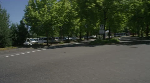 Front view of a Driving Plate: Car turns left out of Legacy Emanuel Hospital Stock Footage 59308657