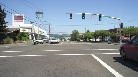 Front view of a Driving Plate: Car turns left from SW Canyon Road onto SW Hall Stock Footage 59321006