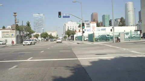 Front view of a Driving Plate: Car turns right from East Olympic Boulevard in Stock Footage 59335997