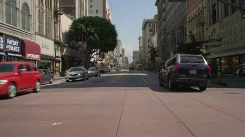 Front view of a Driving Plate: Car travels on South Broadway in Los Angeles, Stock Footage 59336554