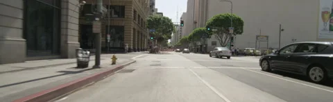 Front view of a Driving Plate: Car travels on Spring Street in Los Angeles, Stock Footage 59355446