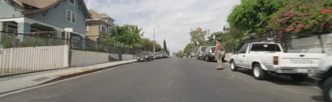 Front view of a Driving Plate: Car travels through a residential area on Bonnie Vidéo 59369167
