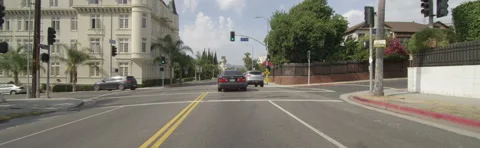 Front view of a Driving Plate: Car travels through residential area on Wilton Stock Footage 59384119