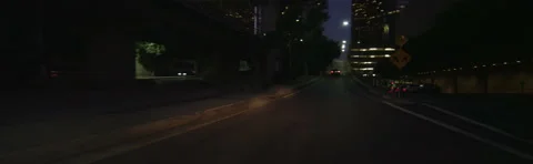 Front view of a Driving Plate: Car travels on 4th Street in Los Angeles at Stock Footage 59445705