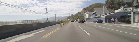 Front view of a Driving Plate: Car travels on Highway 1 in Santa Monica, Stock Footage 59488608