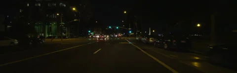 Front view of a Driving Plate: Car travels on Ocean Avenue from Wilshire Stock Footage 59509112