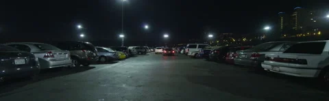 Front view of a Driving Plate: Car travels through the Santa Monica Pier parking Stock Footage 59509587