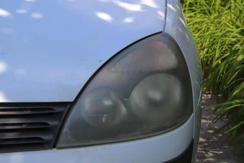 Front view of dusty headlight. Stock Photos