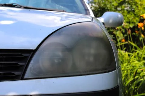 Front view of dusty headlight. Stock Photos