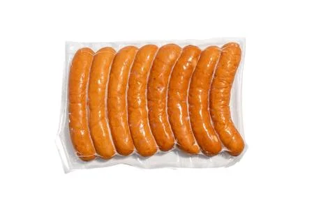 Front view of eight evenly packaged sausages in vacuum film. Stock Photos