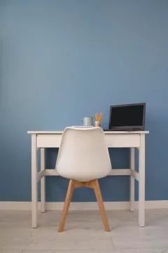 Front view of empty home office of creative entrepreneur with white table during Stock Photos
