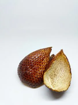 Front view of an empty peeled snake fruit shell showing its scaly texture Stock Photos