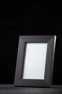 Front view of empty picture frame on a dark background funeral death evil f.. Stock Photos