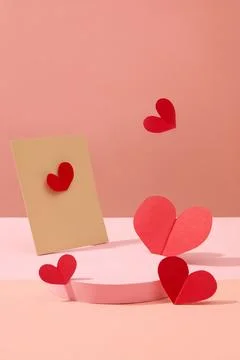 Front view of an empty podium decorated with paper card and red paper hearts  Stock Photos