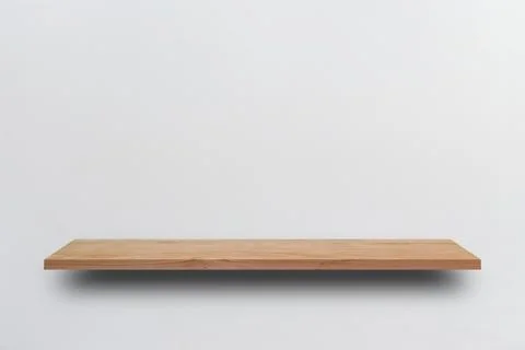 Front view empty wooden shelf and grey wall. Design concept Stock Photos