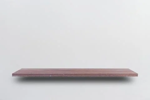 Front view empty wooden shelf and grey wall. Design concept Stock Photos