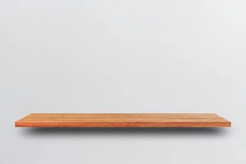 Front view empty wooden shelf and grey wall. Design concept Stock Photos