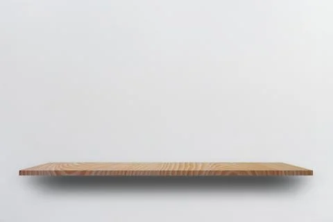 Front view empty wooden shelf and grey wall. Design concept Stock Photos