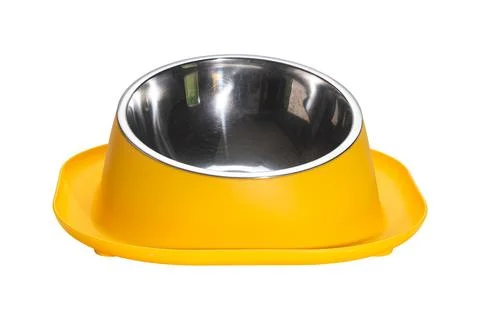 Front view of empty yellow water moat anti ant dog and cat food bowl. Stock Photos