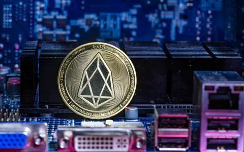 Front view of Eos cryptocurrency physical coin Stock Photos