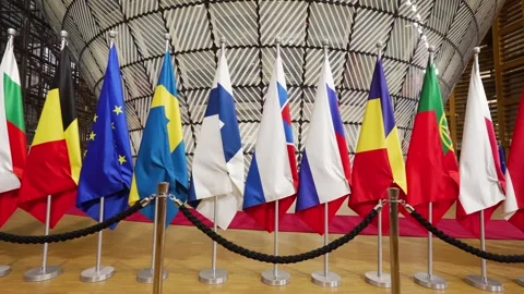 Front view of EU country flags in the European Council building in Brussels Stock Footage 324891641