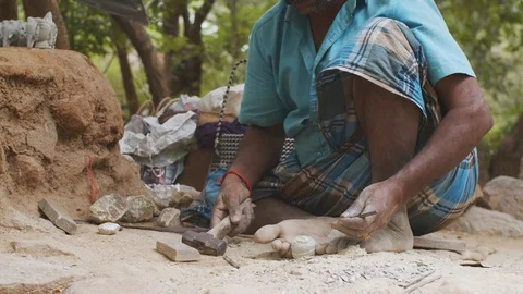 Front view of faceless man making sculptures from stone clay outdoors nature  Stock Footage 125103539