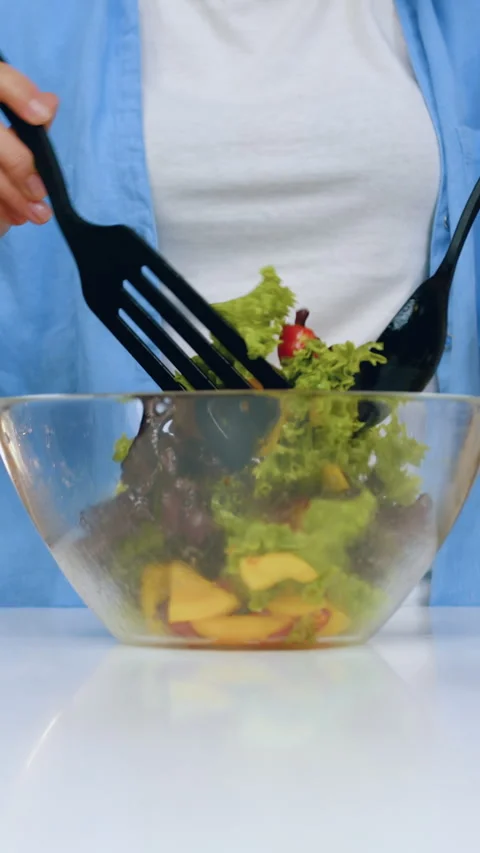 Front view of female hands which holding kitchen spoon and spatula and mixing in Stock Footage 333861758