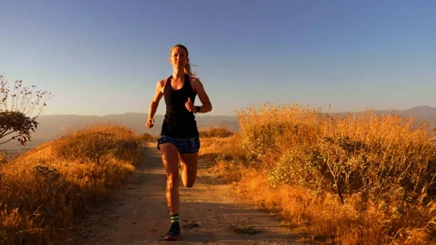 Front View of Female Trail Runner 4K Stock Footage 159516553