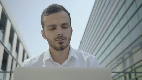 Front view of focused Caucasian manager working on laptop Stock-Footage 97916704
