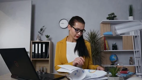 Front view of focused confident attantive businesswoman in glasses dressed in Stock Footage 124702580