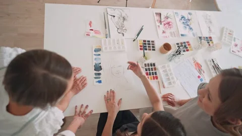 Front view of four beautiful caucasian female at art workshop. A young teacher Stock Footage 159780184