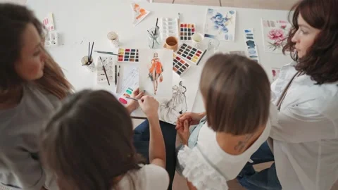 Front view of four beautiful caucasian female at art workshop. A young teacher Stock Footage 159909982