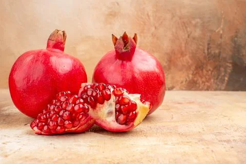 Front view fresh red pomegranate on light background red color photo mellow.. Stock Photos
