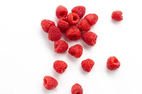 Front view fresh red raspberries mellow and sour all over the white backgor.. Stock Photos