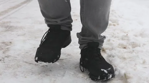 Front view of a frozen standing man in black boots in winter. Stock Footage 262370441