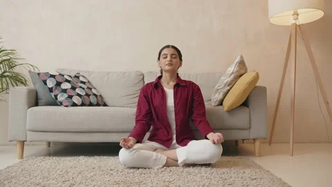 Front view full body portrait of relaxed indian woman doing yoga exercise Stock Footage 239567635