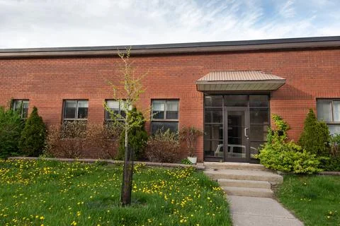 Front view of Generic small business building exterior Stock Photos