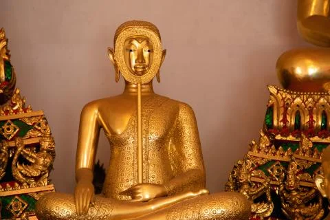 Front view of a gold Buddha inside a temple in Bangkok Stock Photos