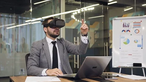 Front view of good-looking contented bearded manager in virtual reality headset Stock Footage 124845058