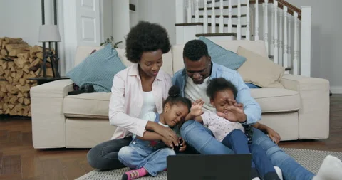 Front view of good-looking joyful lucky carefree black-skinned family with small Stock Footage 144348292