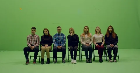 Front view group of young people sitting, applause and looking at smth Video stock 105835762